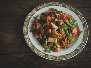 Vintage style Thai traditional and Chinese food stir fried vegetable in brown sauce with dried shrimp
