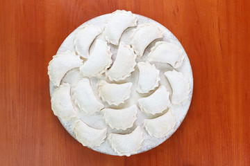 Cooking dumplings, vareniki before boiling. Traditional Ukrainian food