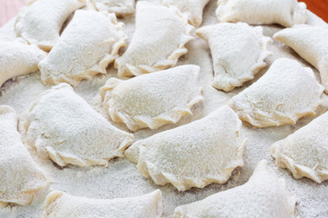 Cooking dumplings, vareniki before boiling. Traditional Ukrainian food