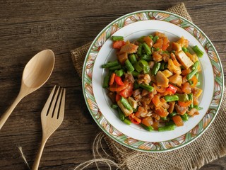 Vintage style Thai traditional and Chinese food stir fried vegetable in brown sauce with dried shrimp