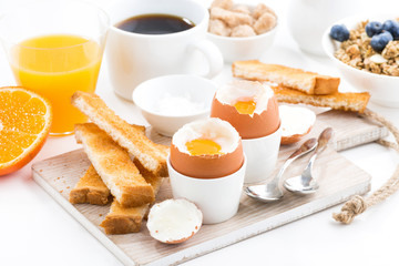 delicious breakfast with boiled eggs and crispy toasts, horizontal