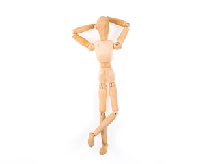 Figurine of a wooden little man on a white isolated background