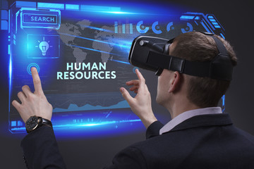 Business, Technology, Internet and network concept. Young businessman working on a virtual screen of the future and sees the inscription: Human resources