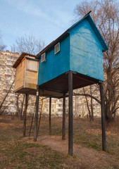 Dovecote on the background of a panel house