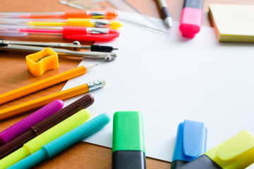 Desk of artist with lots of objects. Studio shot on wooden table.