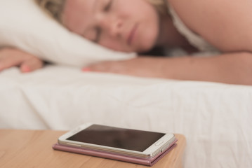 Smartphone near her bed