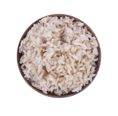 Brown rice on wood cup on white background