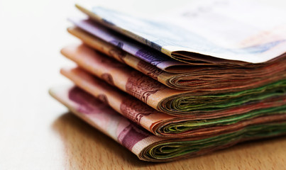 batches of thai banknote on table