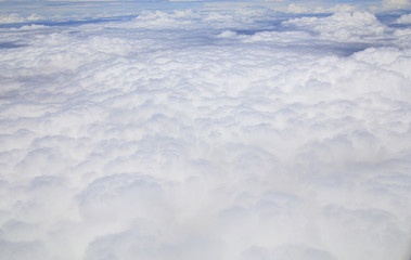 Sky and cloud as seen through window of an aircraft