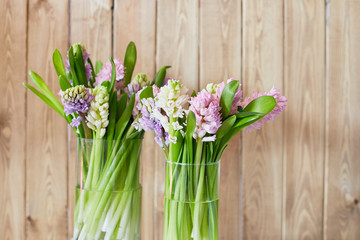 Spring background with hyacinths. Background with spring flowers. Bouquet of hyacinths on a wooden background
