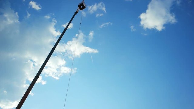 ropejumping from a high tower, man bouncing on string, jumping with insurance from height, fear of heights, fall off from height with rope, acrophobia, hovering with rope from high tower