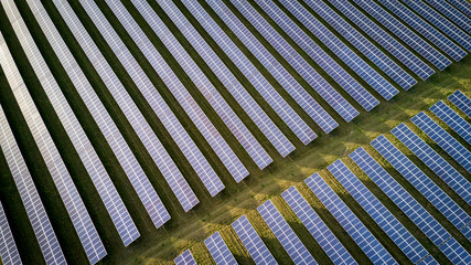 Solar energy farm. High angle, elevated view of solar panels on an energy farm in rural England;...