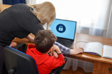 Mother locking on computer for son, parental control