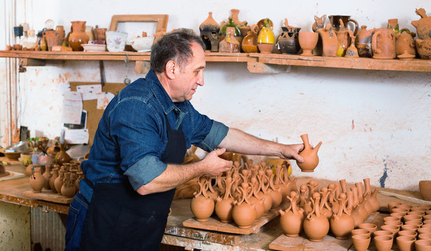 Happy potter at the workshop - Powered by Adobe