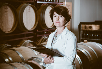 Expert examines equipment at winery