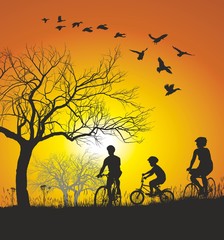 Naklejka na ściany i meble Family cycling in the countryside