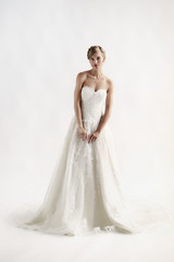 Fototapeta premium Portrait of beautiful bride on white background