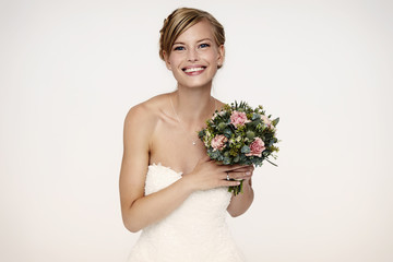 Gorgeous bride holding flowers, portrait