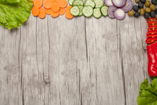 Various fresh vegetables shot on wooden background