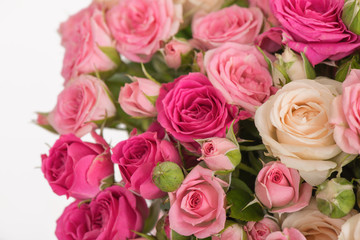 Closeup of pink tender roses with buds background