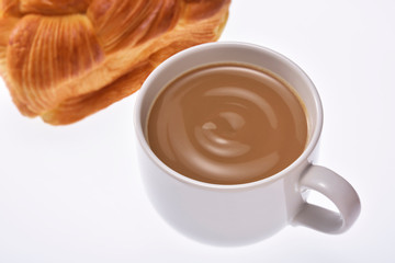 Coffee cream in a white cup on white background