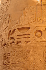 Ancient Egypt. The columns are decorated with carved hieroglyphs. Karnak Temple. Luxor. Thebes.