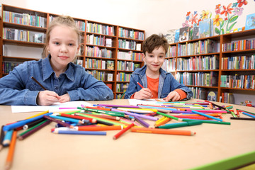 Children doing homework in the library
