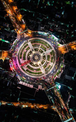 Fototapeta na wymiar Road roundabout with car lots Wongwian Yai in Bangkok,Thailand. street large beautiful downtown at evening light. Aerial view , Top view ,cityscape ,Rush hour traffic jam