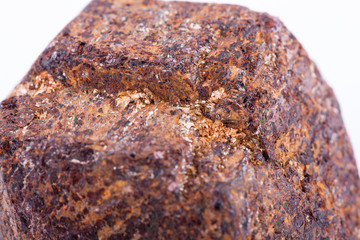 Macro stone mineral Garnet against white background