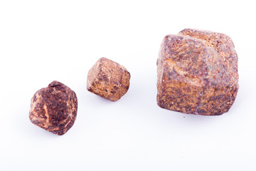 Macro stone mineral Garnet against white background