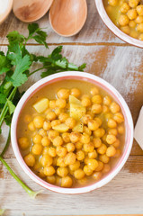 Chickpea soup on wooden background. Top view. Selective focus. Eastern cuisine