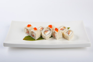sushi roll with omelette and Philadelphia cheese with salmon and red caviar
