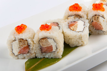 sushi roll with omelette and Philadelphia cheese with salmon and red caviar