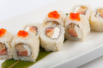 sushi roll with omelette and Philadelphia cheese with salmon and red caviar