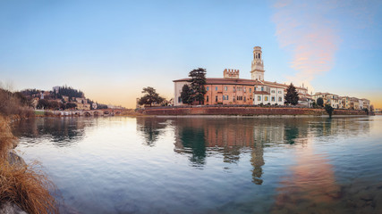 Obraz premium historical quarter of Verona, panorama from river on ponte Pietra bridge and Duomo Cathedral at sunrise