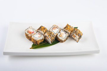 sushi roll with salmon, cream cheese, scrambled eggs, sesame