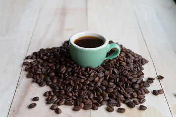 Coffee. Coffee beans. Coffee cup full of coffee beans. Toned image.