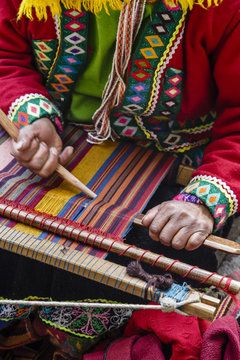 Quechua woman weaving traditional textile, Cuzco, Peru