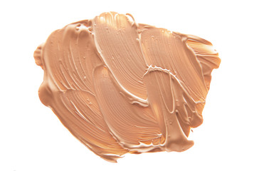 Smudged liquid foundation isolated on white