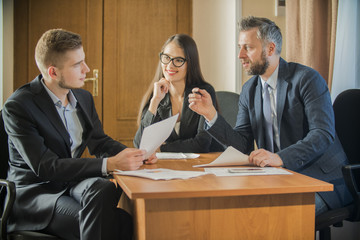 three businessmen two male and female office workers, businessperson thinking about ways to overcome business obstacle, 

two men and woman office workers