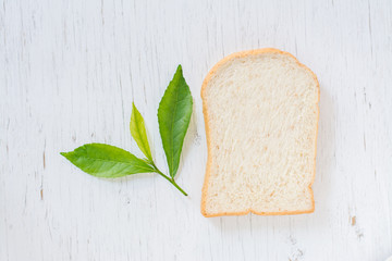 Cut fresh bread on the wood table,Sliced bread to toast on wood background. Close up. Top view
