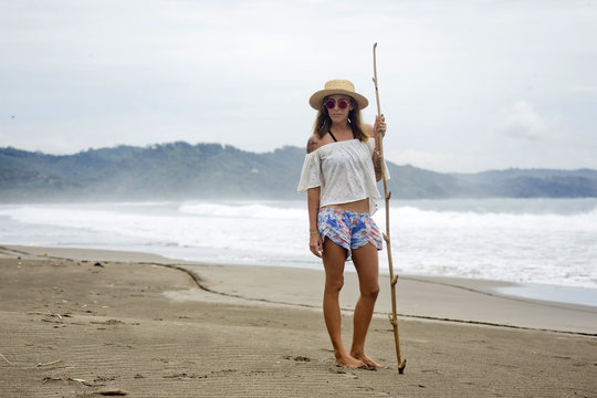 Indonesia, Java, portrait of woman standing on the beach