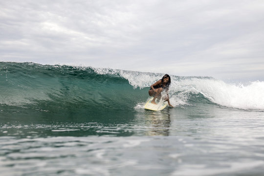 Indonesia, Java, woman surfing