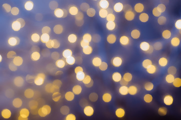 Fototapeta na wymiar Festive background with bokeh lights. Christmas and New year
