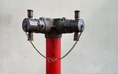 Old red metallic fire hydrant on street