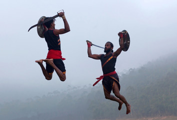 Indian fighters performing Kalarippayattu Martial Art demonstration in Kerala, India