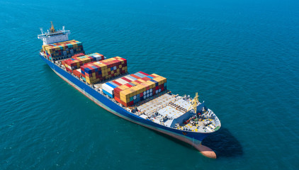 container ship in import export and business logistic.By crane ,Trade Port , Shipping.cargo to harbor.Aerial view.Top view.