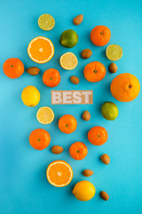 Photo of citrus fruits, lemons, oranges, limes, mandarines, nuts, view from above, cyan background, isolated