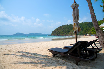 Beach chairs and coconut plam trees at Samed island, Thailand