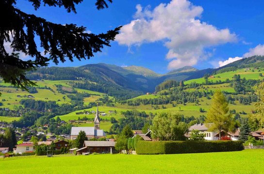 Beautiful view of Niedernsill town and surrounding countryside in summer - Zell am See,  district, state of Salzburg, Austria